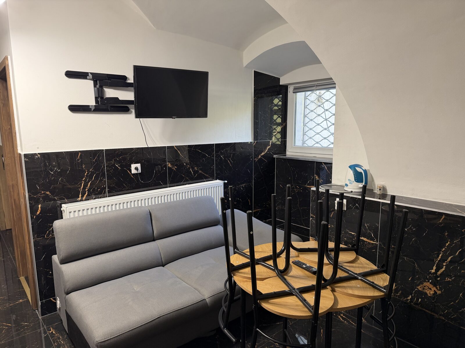 Tuson Apartment lounge with sofa and TV